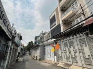 BÁN NHÀ HẺM XE HƠI LÊ QUANG ĐỊNH – GẦN PHẠM VĂN ĐỒNG – 4 TẦNG – 7PN